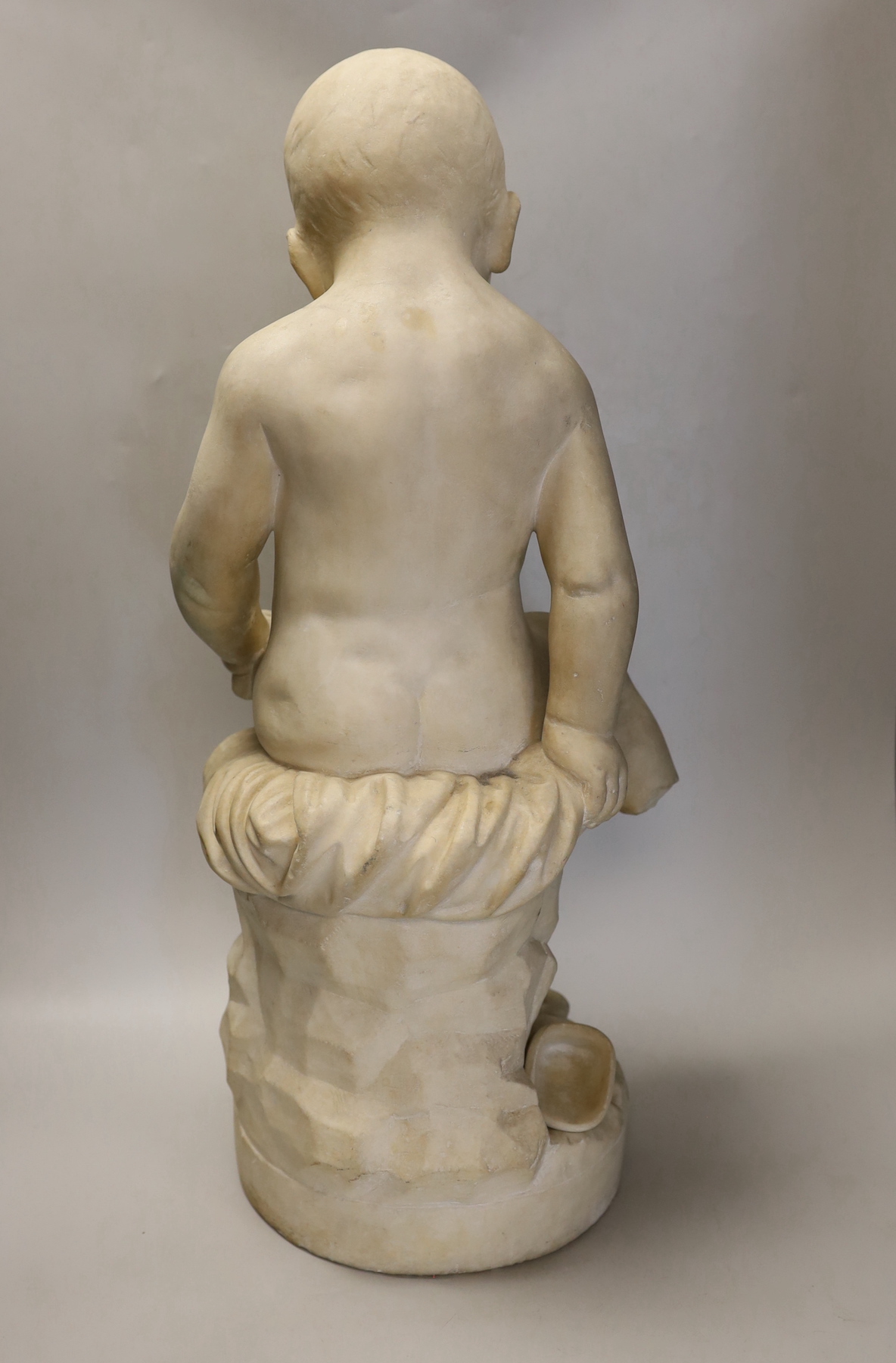 A 19th century French white marble carving of a boy and a cat, 60cm high